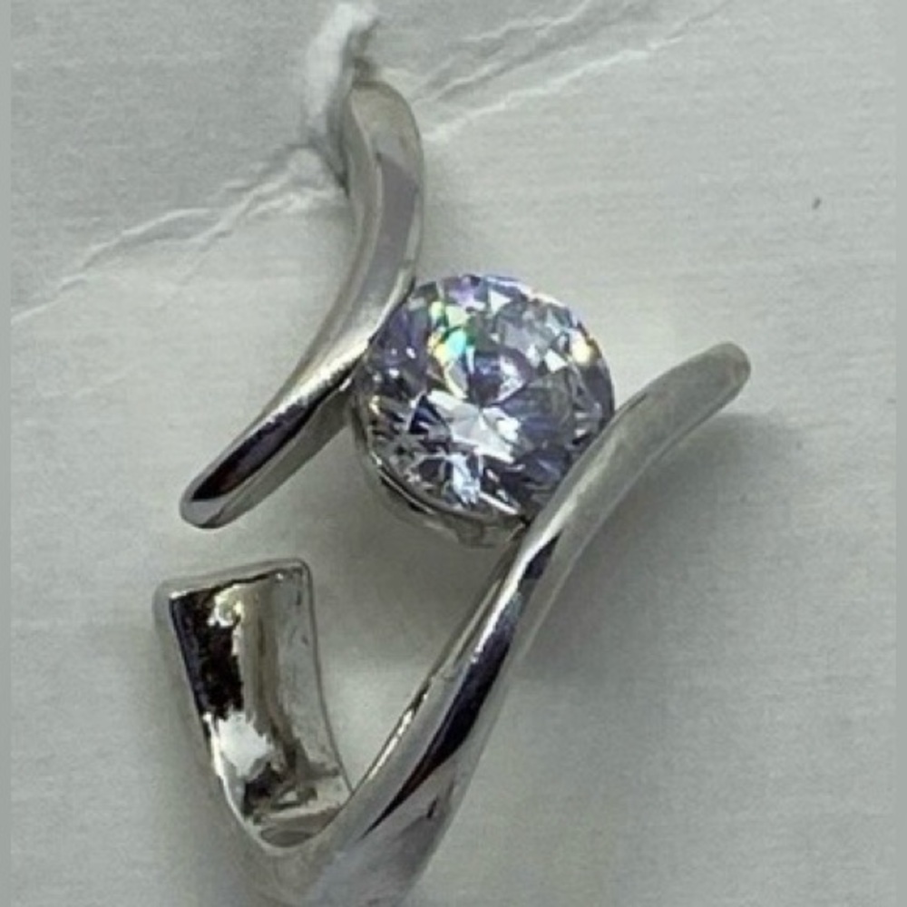 Silver tone Contemporary clear CZ pierced earrings.